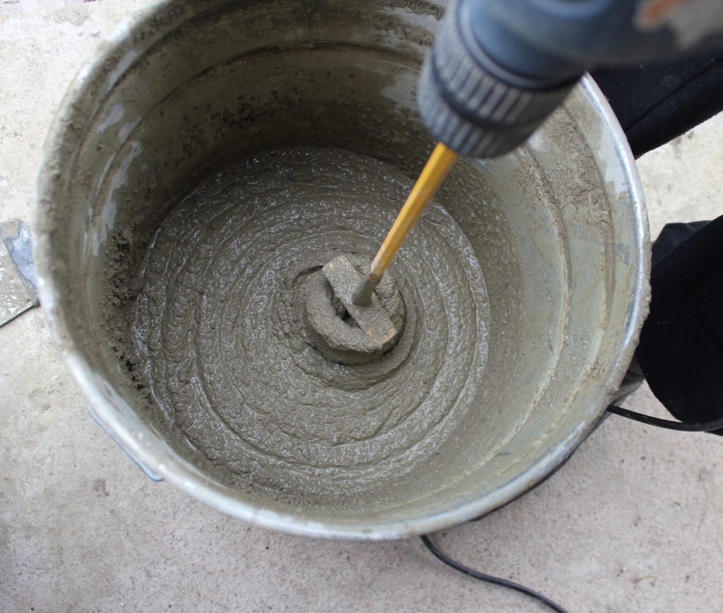 mixing concrete in a 5 gallon bucket